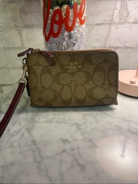 COACH Signature Canvas Wristlet in Brown with Burgundy Strap